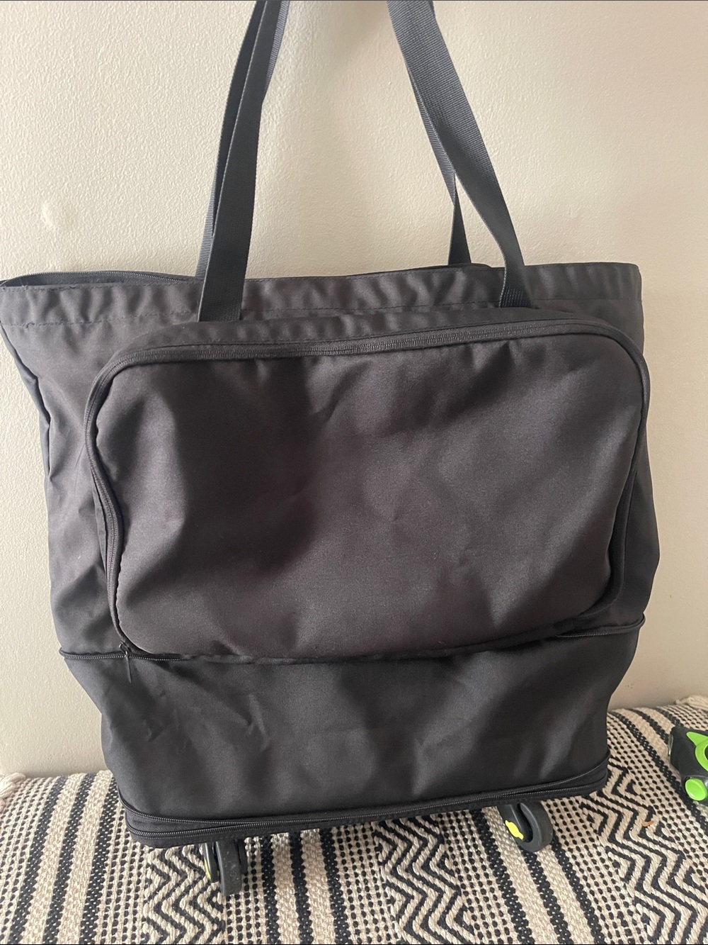 Black expandable collapsing Tote Bag with Front Pocket and removable wheels